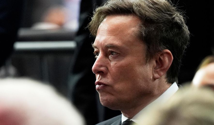 Elon Musk attends a memorial for conservative activist Charlie Kirk, Sunday, Sept. 21, 2025, at State Farm Stadium in Glendale, Ariz. (AP Photo/Julia Demaree Nikhinson, File)