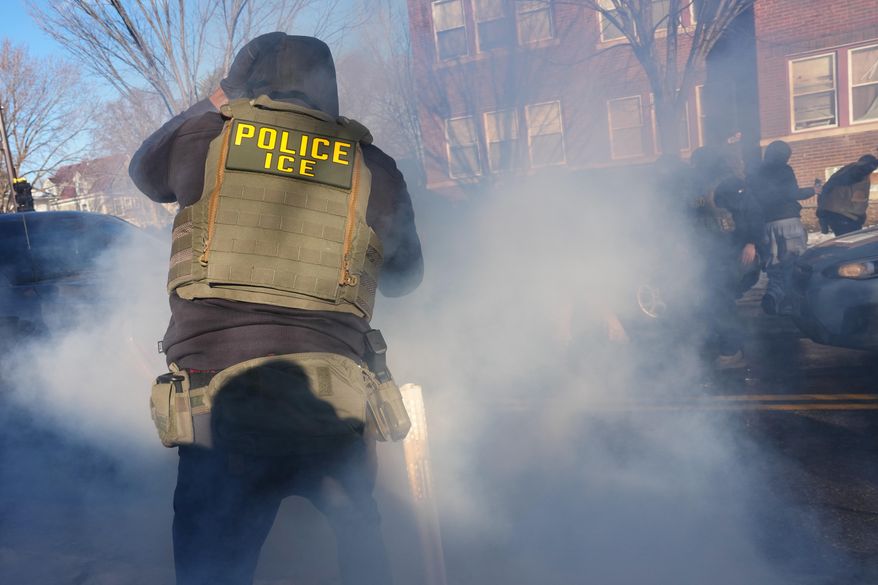 Tear gas is deployed amid protesters near the scene where Renee Good was fatally shot by an ICE officer last week, Tuesday, Jan. 13, 2026, in Minneapolis.(AP Photo/Adam Gray) **FILE**