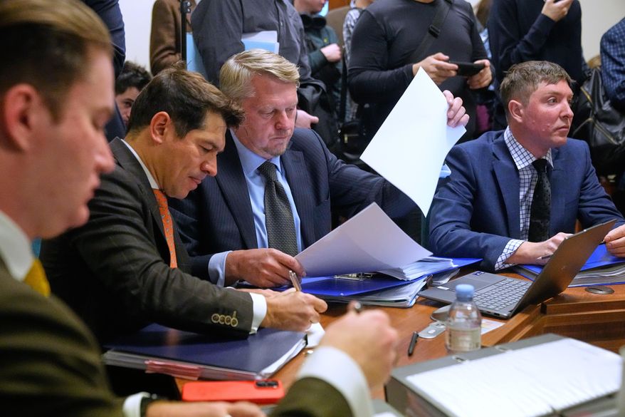 Participants gather in Moscow's Arbitration Court to hold a hearing to consider a lawsuit by Russia's Central Bank against Belgium-based financial clearinghouse Euroclear in Moscow, Russia, Friday, Jan. 16, 2026. (AP Photo/Pavel Bednyakov)