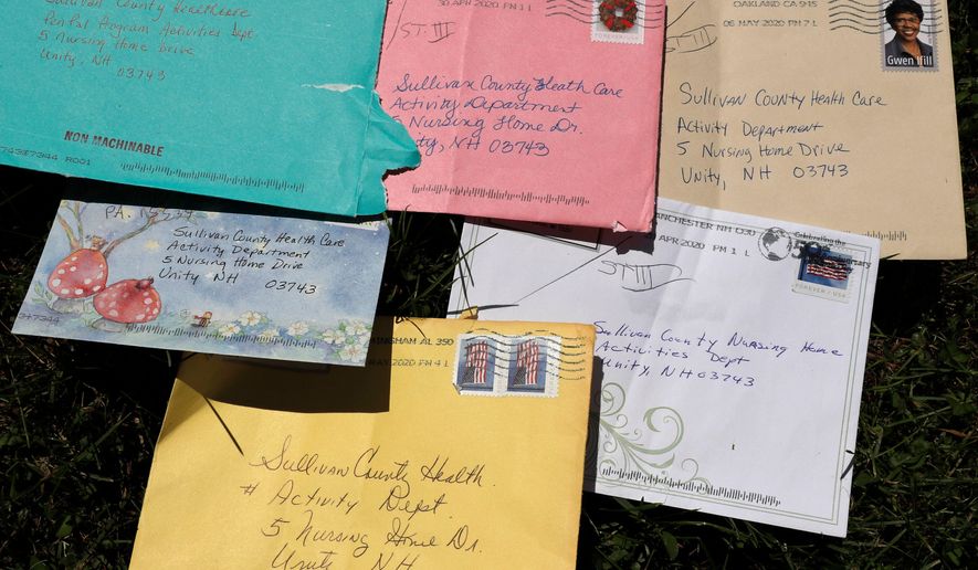 Pen pal letters are displayed outside the Sullivan County Health Care nursing home in Unity, N.H., June 8, 2020. (AP Photo/Charles Krupa, File)