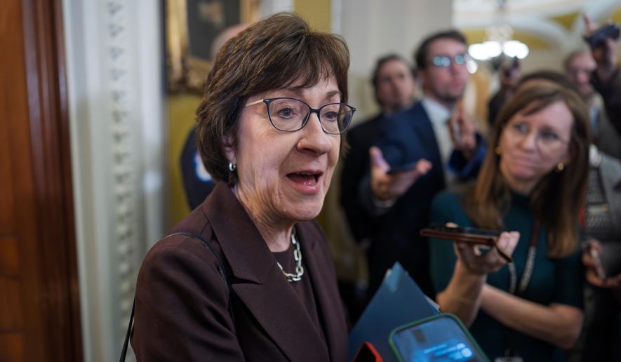 Sen. Susan Collins, R-Maine, chair of the Senate Appropriations Committee, is met by reporters outside the Senate chamber, at the Capitol in Washington, Tuesday, Jan. 6, 2026. (AP Photo/J. Scott Applewhite)