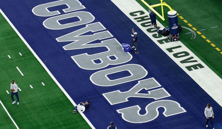 The word's "Choose Love" are displayed in the end zone at AT&T Stadium before a NFL football game between the Washington Commanders and the Dallas Cowboys on Sunday, Jan. 5, 2025, in Arlington, Texas. (AP Photo/Matt Patterson, File)
