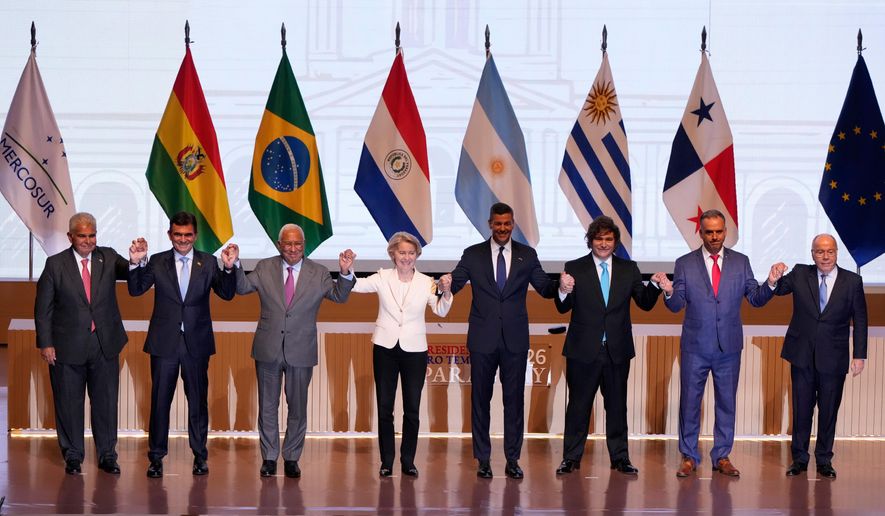 Panama's President Jose Raul Mulino, from left, Bolivian President Rodrigo Paz, European Council President Antonio Costa, European Commission President Ursula von der Leyen, Paraguay's President Santiago Pena, Argentina's President Javier Milei, Uruguay's President Yamandu Orsi and Brazilian Minister of Foreign Affairs Mauro Vieira, pose for a group photo during a meeting to sign a free trade deal between the European Union and Mercosur in Asuncion, Paraguay, Saturday, Jan. 17, 2026. (AP Photo/Jorge Saenz)