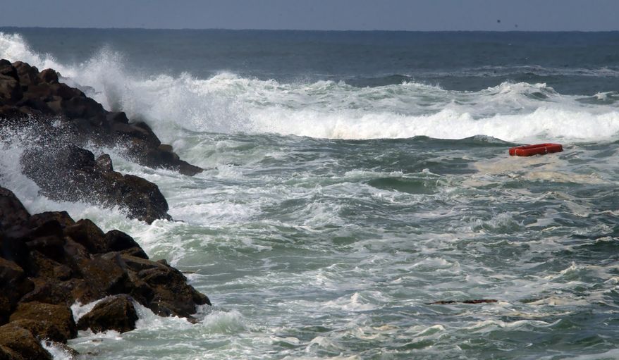 A life raft floats in the area at the north bar of Tillamook Bay where a charter boat "Taki Tooo", capsized, drowning at least nine in Garibaldi, Ore., Saturday June 14, 2003. (AP Photo/Greg Wahl-Stephens)