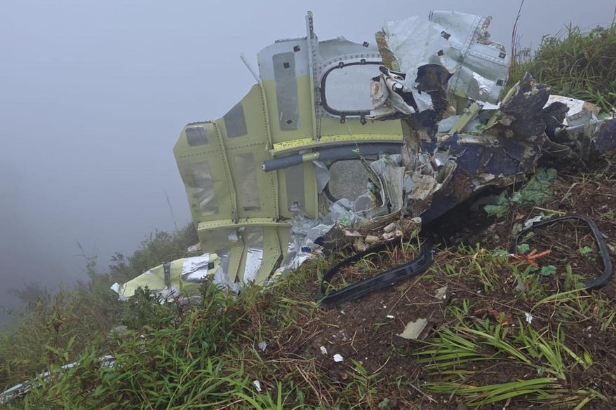 This photo provided by the Indonesian National Search and Rescue Agency (BASARNAS) shows debris of an ATR 42-500 turboprop airplane at Mount Bulusaraung in South Sulawesi province, Indonesia, Sunday, Jan. 18, 2026, after the aircraft lost contact Saturday. (BASARNAS via AP)