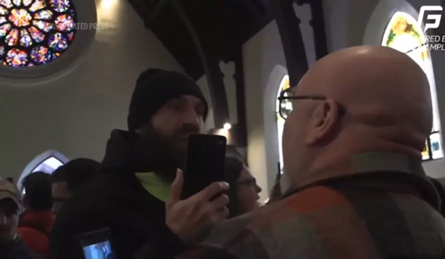 The U.S. Department of Justice said Sunday it is investigating a group of protesters in Minnesota who disrupted services at a church where a local official with U.S. Immigration and Customs Enforcement apparently serves as a pastor. (AP video screenshot)