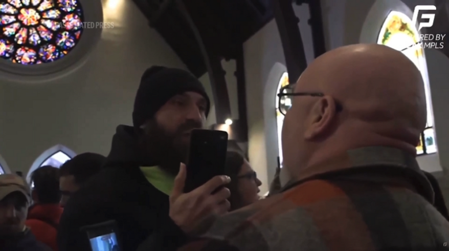 The U.S. Department of Justice said Sunday it is investigating a group of protesters in Minnesota who disrupted services at a church where a local official with U.S. Immigration and Customs Enforcement apparently serves as a pastor. (AP video screenshot)