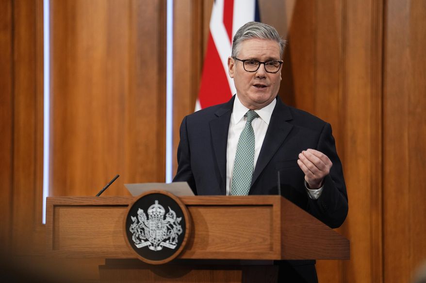 Britain's Prime Minister Keir Starmer delivers a statement in the media briefing room of 9 Downing Street, in central London, Monday, Jan. 19, 2026. (Jordan Pettitt/Pool Photo via AP)