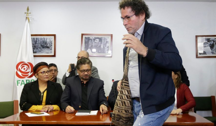 Jose Lisandro Lascarro, a former FARC commander known as “Pastor Alape,” exits a press conference in Bogota, Colombia, April 10, 2018. (AP Photo/Fernando Vergara, File)