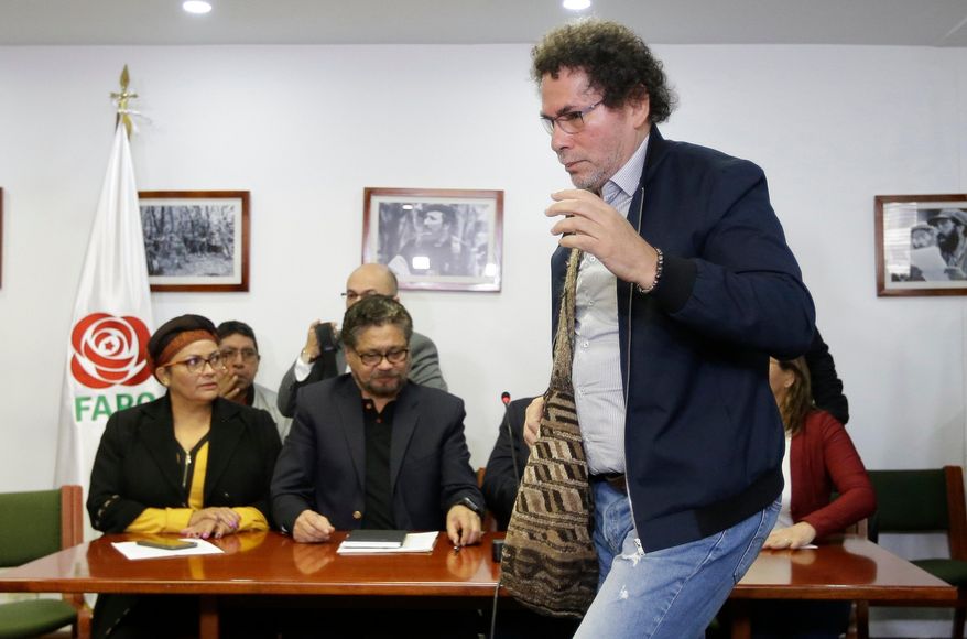 Jose Lisandro Lascarro, a former FARC commander known as “Pastor Alape,” exits a press conference in Bogota, Colombia, April 10, 2018. (AP Photo/Fernando Vergara, File)