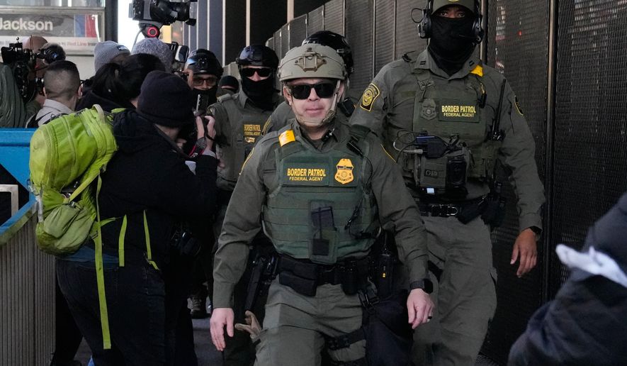 U.S. Customs and Border Patrol agents arrive to escort U.S. Customs and Border Patrol Gregory Bovino from federal court in Chicago, Oct. 28, 2025. (AP Photo/Nam Y. Huh, File)