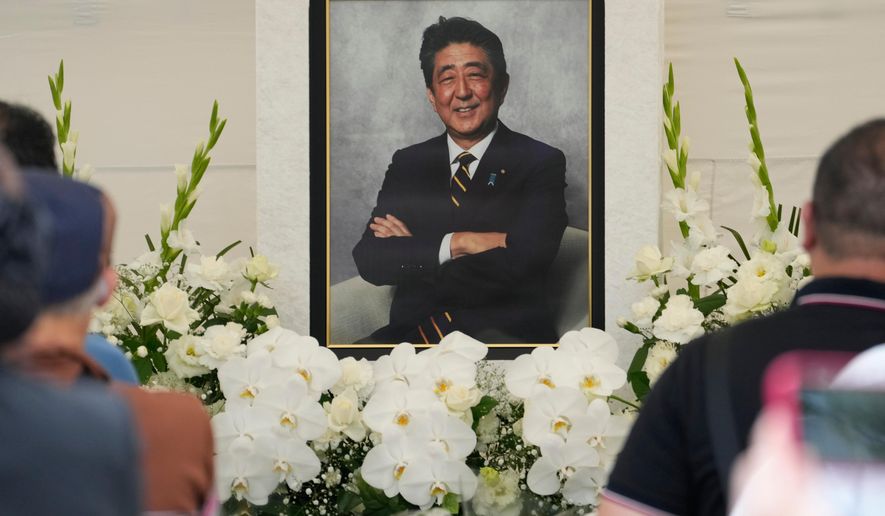 People offer prayers for former Prime Minister Shinzo Abe at Zojoji temple in Tokyo, Japan, July 8, 2023. (AP Photo/Shuji Kajiyama, File)