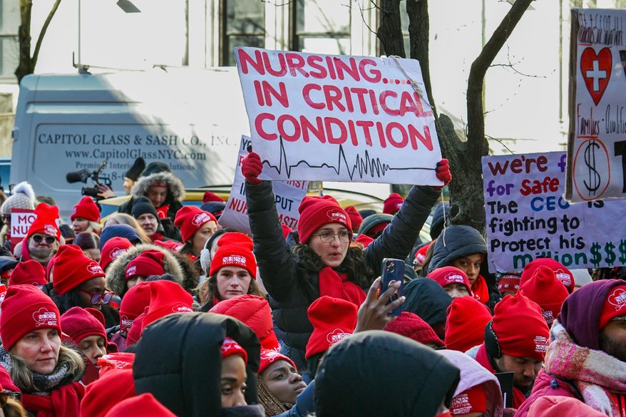 Members of the New York State Nurses Association union picket outside Mount Sinai West Hospital, Tuesday, Jan. 20, 2026, in New York. (AP Photo/Ryan Murphy)
