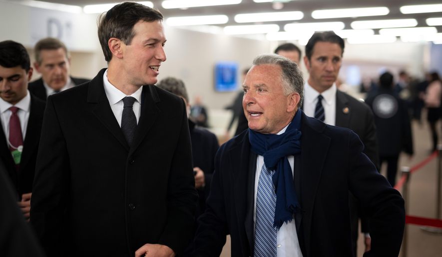 Jared Kushner, left, and Steve Witkoff walk in the corridors during the 56th annual meeting of the World Economic Forum, WEF, in Davos, Switzerland, Tuesday, Jan. 20, 2026. (Gian Ehrenzeller/Keystone via AP)