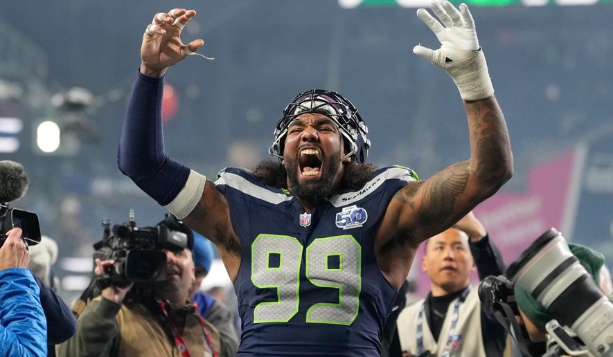 Seattle Seahawks defensive tackle Leonard Williams (99) reacts after NFL football divisional playoff game against the San Francisco 49ers, Saturday, Jan. 17, 2026, in Seattle. (AP Photo/Stephen Brashear)