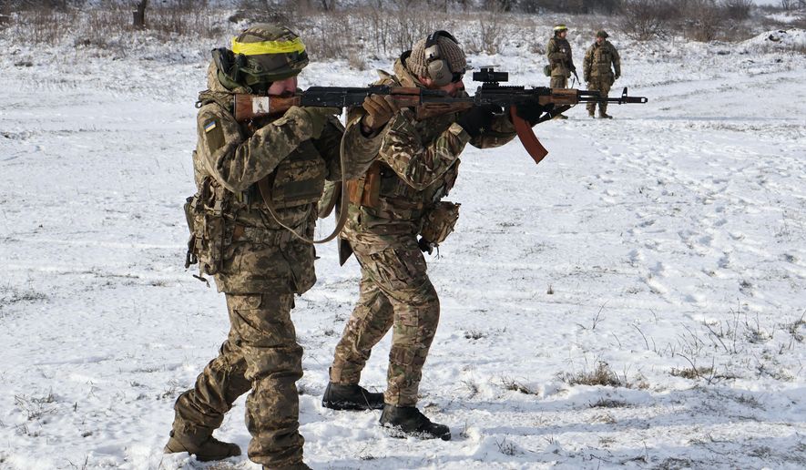 CORRECTS DATE In this photo provided by Ukraine's 65th Mechanized Brigade press service, recruits perform drills at a training ground in the Zaporizhzhia region, Ukraine, Tuesday, Jan. 20, 2026. (Andriy Andriyenko/Ukraine's 65th Mechanized Brigade via AP)