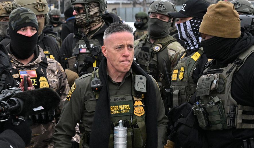 U.S. Border Patrol Cmdr. Gregory Bovino arrives as protesters gather outside the Bishop Henry Whipple Federal Building, Thursday, Jan. 8, 2026, in Minneapolis, Minn. (AP Photo/Tom Baker)