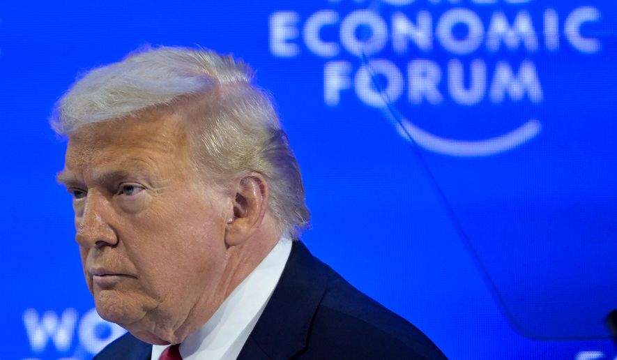 President Donald Trump enters the stage for his special address during the 56th annual meeting of the World Economic Forum, WEF, in Davos, Switzerland, Wednesday, Jan. 21, 2026. (Gian Ehrenzeller/Keystone via AP)