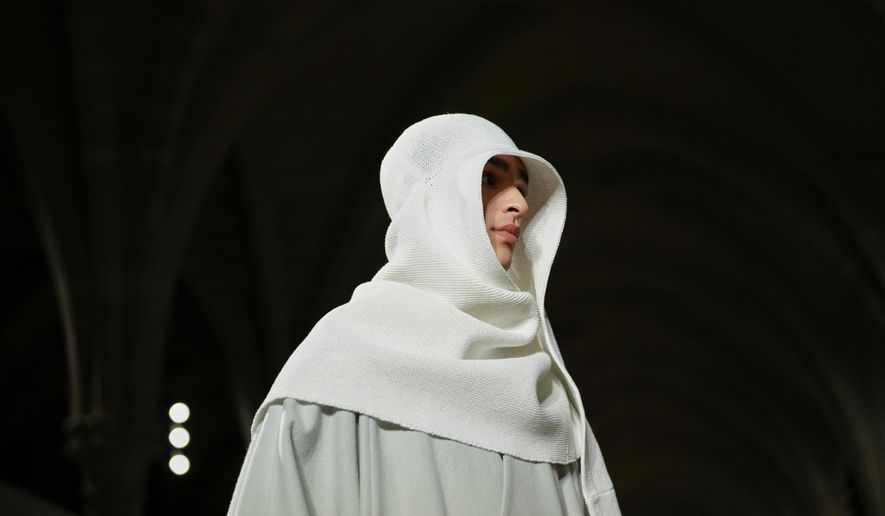 A model wears a creation as part of the Issey Miyake Fall/Winter 2026-2027 Men's collection presented in Paris, Thursday, Jan. 22, 2026. (AP Photo/Aurelien Morissard)