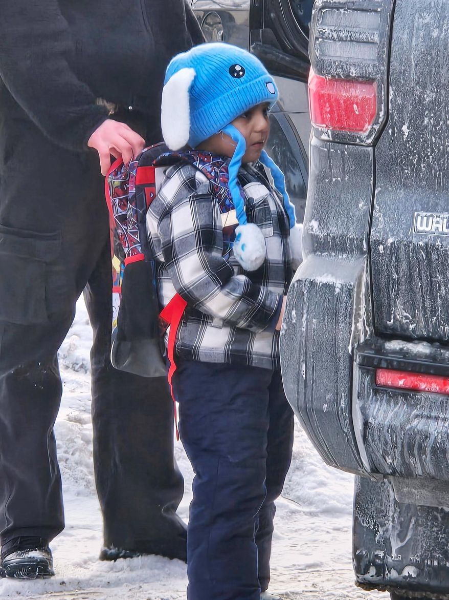 Liam Conejo Ramos, 5, is detained by U.S. Immigration and Customs Enforcement officers after arriving home from preschool, Tuesday, Jan. 20, 2026, in a Minneapolis suburb. (Ali Daniels via AP)