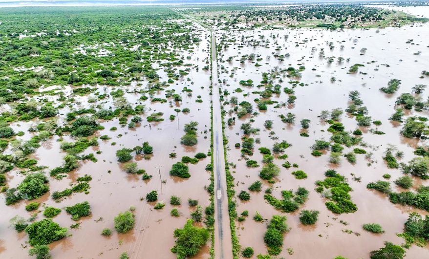 Flood waters cover the Chibuto-Chaimite road in Gaza province, Mozambique, Saturday, Jan. 17, 2026. (AP Photo)
