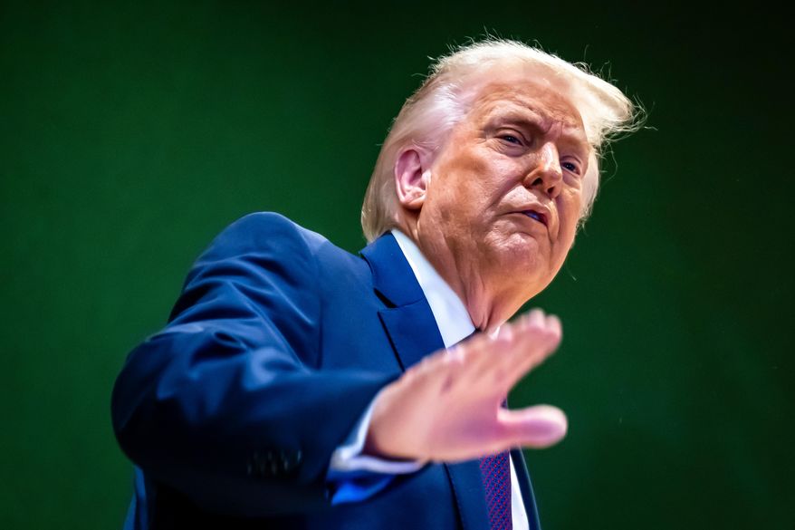 U.S. President Donald Trump gestures as he climbs a staircase after a signing ceremony of his Board of Peace initiative at the Annual Meeting of the World Economic Forum in Davos, Switzerland, Thursday, Jan. 22, 2026. (Laurent Gillieron/Keystone via AP)