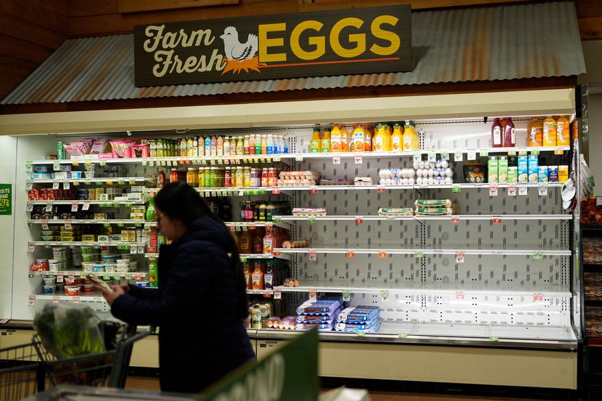 A shopper buys groceries Wednesday, Jan. 21, 2026, in Nashville, Tenn., ahead of a winter storm expected to hit the state over the weekend. (AP Photo/George Walker IV)