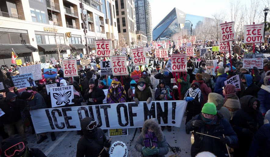 People protest against Federal immigration agents on Friday, Jan. 23, 2026, in Minneapolis. (AP Photo/Angelina Katsanis)