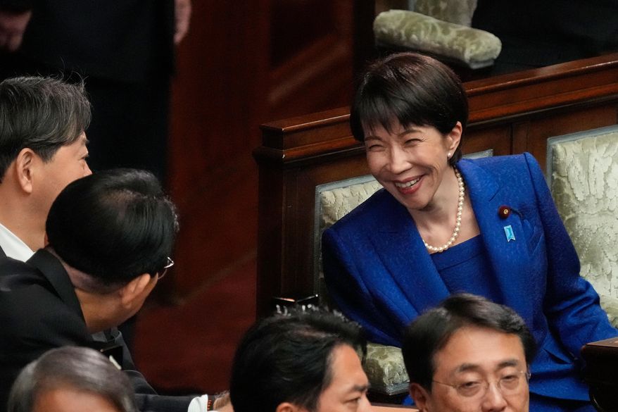 Japanese Prime Minister Sanae Takaichi, right, and other lawmakers speak before dissolving the lower house, during an extraordinary Diet session at the lower house of parliament Friday, Jan. 23, 2026, in Tokyo. (AP Photo/Eugene Hoshiko)