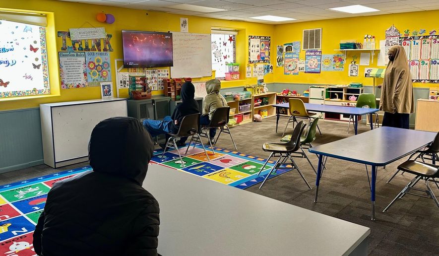 FILE - Children watch television at ABC Learning Center in Minneapolis, Minn., Dec. 31, 2025. (AP Photo/Mark Vancleave, File)