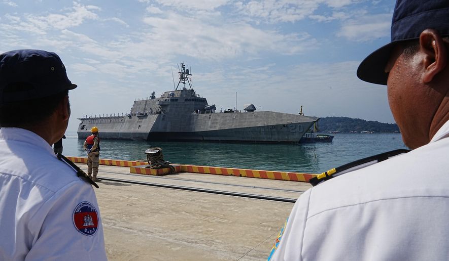 Cambodian naval members welcome U.S. warship USS Cincinnati, getting docked upon arrival at Ream Naval Base's pier in Sihanoukville Cambodia, Saturday, Jan. 24, 2026. (AP Photo/Heng Sinith)