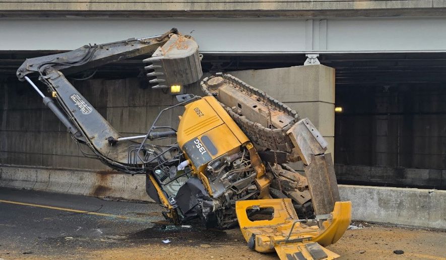 An excavator fell off a truck going southbound on Interstate 395 on Friday, January 23, 2026. (Photo credit: DC Fire and EMS Department)
