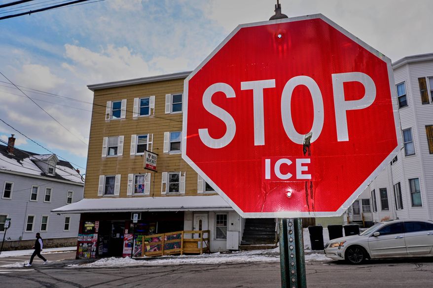 Anti-ICE sentiment is expressed on a traffic sign, Friday, Jan. 23, 2026, in Biddeford, Maine.(AP Photo/Robert F. Bukaty)