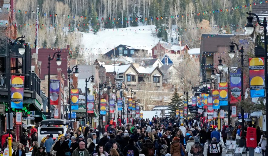 Pedestrians walk down Main Street on the first day of the 2026 Sundance Film Festival on Thursday, Jan. 22, 2026, in Park City, Utah. (Photo by Charles Sykes/Invision/AP)