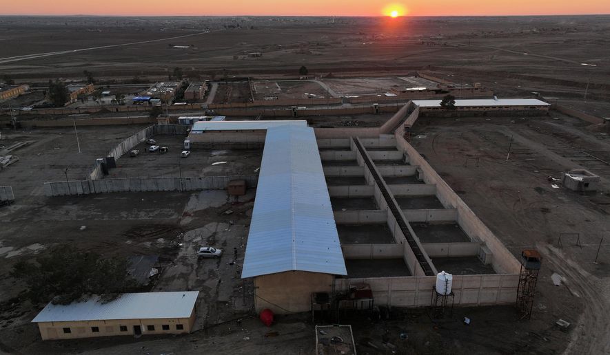 An aerial view shows Shaddadeh prison complex in the town of Shaddadeh, northeastern Syria, Tuesday, Jan. 20, 2026, a day after Syria's Interior Ministry said Islamic State group members escaped from the facility during clashes with the Kurdish-led Syrian Democratic Forces. (AP Photo/Ghaith Alsayed)