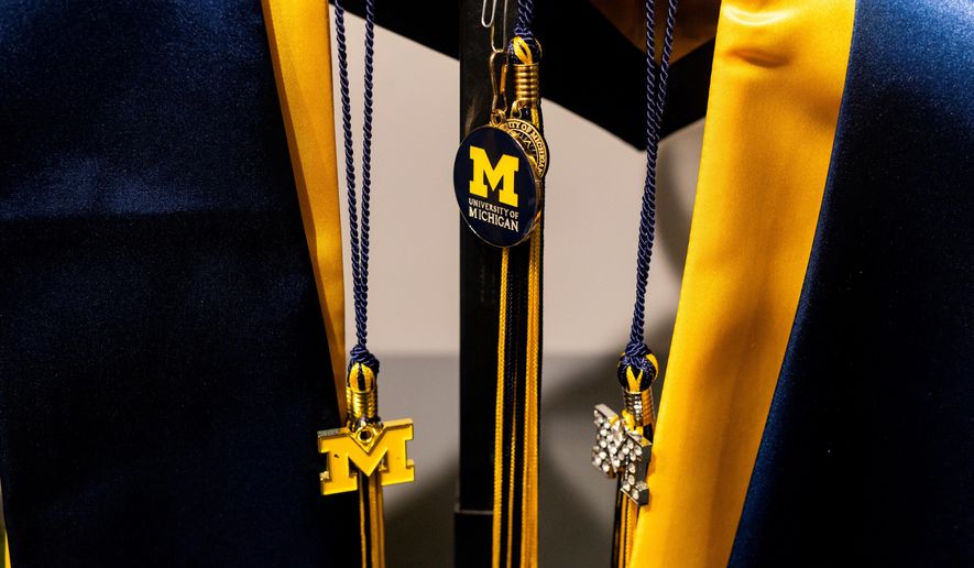 Graduation apparel is seen on display at a store at the Michigan Union on the University of Michigan campus in Ann Arbor, Mich., Jan. 17, 2026. (AP Photo/Emily Elconin)