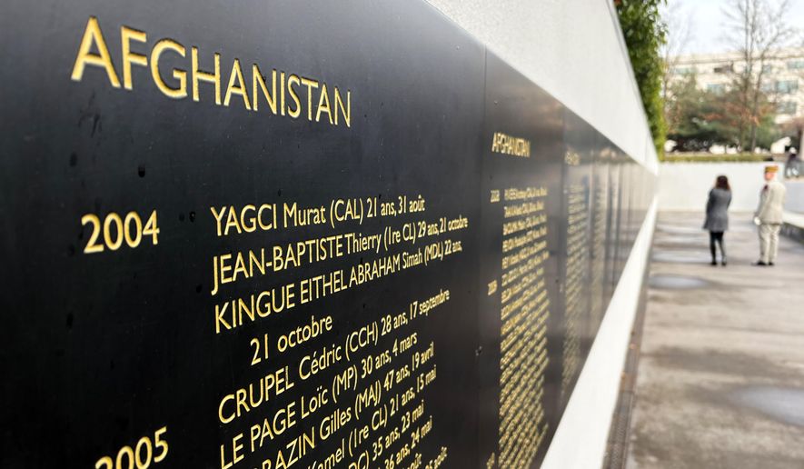 The names of French troops killed in NATO operations in Afghanistan, where they fought with U.S. and other allied forces, are displayed Monday, Jan. 26, 2026, at a memorial in Paris to French troops killed in operations overseas (AP Photo/John Leicester)