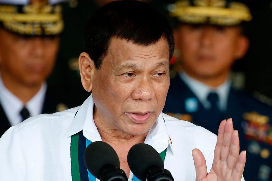 Philippine President Rodrigo Duterte addresses the troops during the 82nd anniversary celebration of the Armed Forces of the Philippines in suburban Quezon city northeast of Manila, Philippines on Dec. 20, 2017. (AP Photo/Bullit Marquez, File)