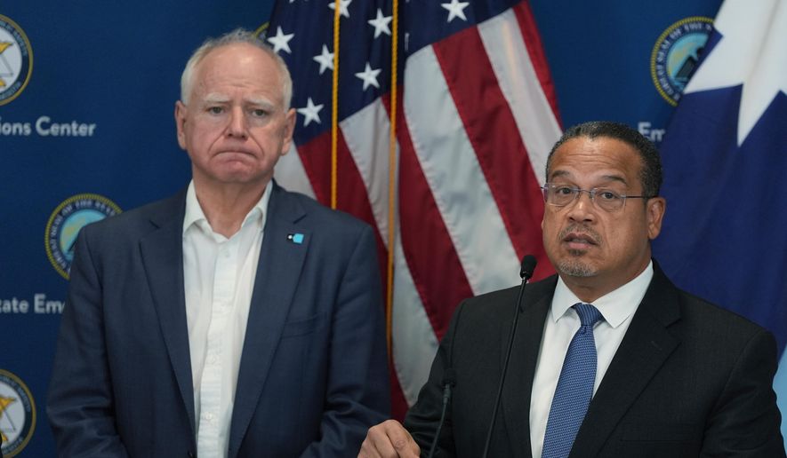 Attorney General Keith Ellison, right, and Minnesota Gov. Tim Walz give a news conference in Blaine, Minn., Sunday, Jan. 25, 2026. (AP Photo/Abbie Parr) ** FILE **