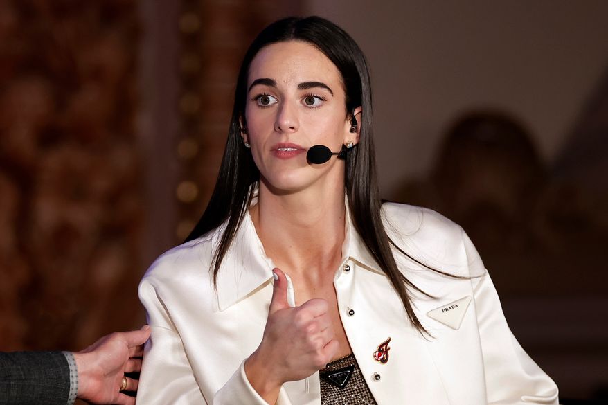 Indiana Fever's Caitlin Clark reacts during an interview during the WNBA basketball draft, April 15, 2024, in New York. (AP Photo/Adam Hunger, File)