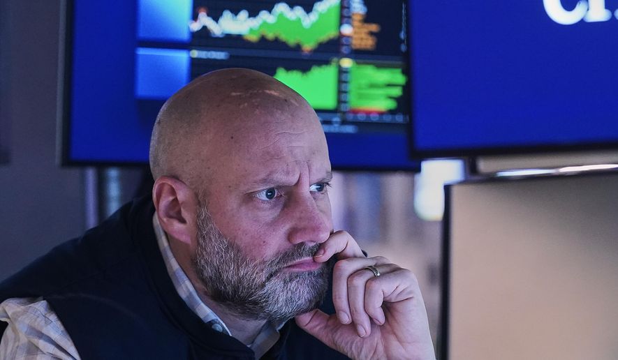 Specialist Meric Greenbaum works at his post on the floor of the New York Stock Exchange, Monday, Jan. 26, 2026. (AP Photo/Richard Drew)