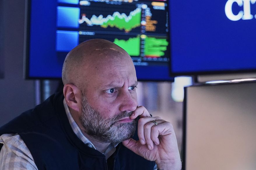 Specialist Meric Greenbaum works at his post on the floor of the New York Stock Exchange, Monday, Jan. 26, 2026. (AP Photo/Richard Drew)