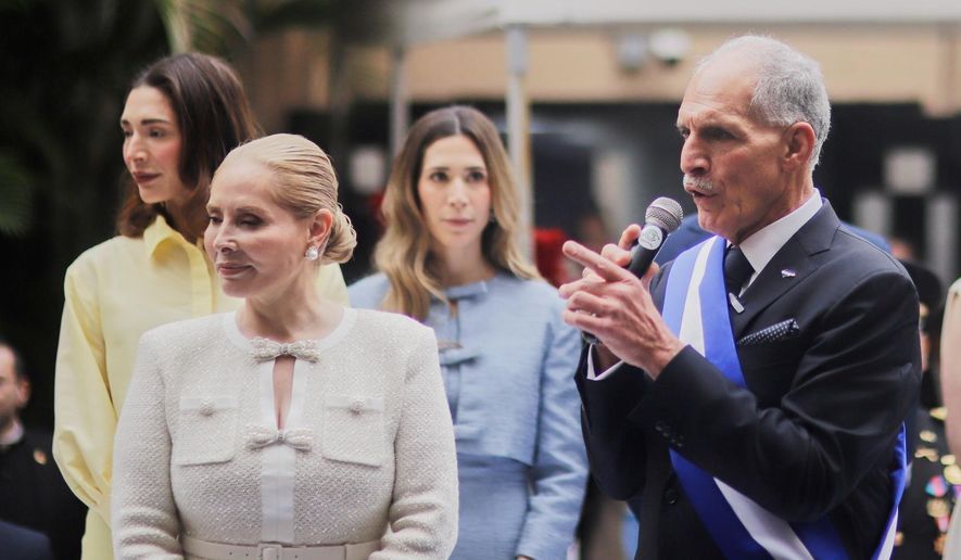 Honduran President Nasry Asfura speaks next to his wife, first lady Lissette del Cid, after his inauguration ceremony as they leave Congress in Tegucigalpa, Honduras, Tuesday, Jan. 27, 2026. (AP Photo/Fernando Destephen)