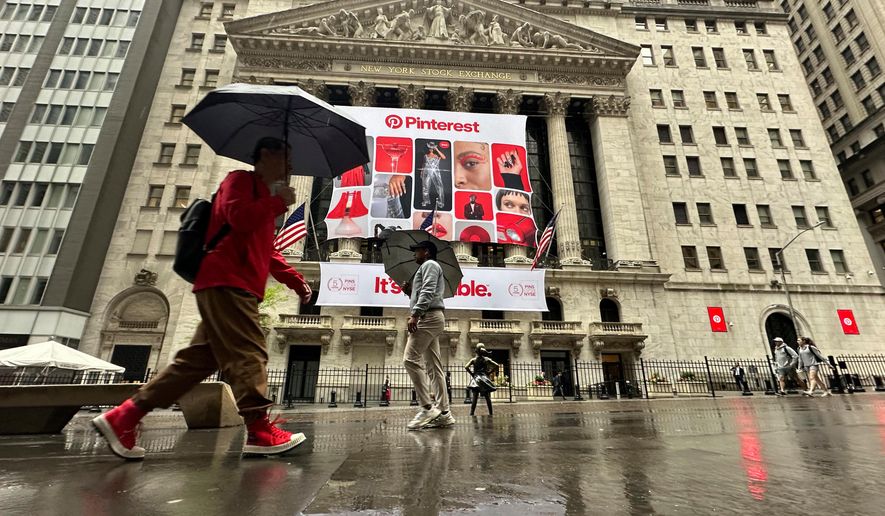 Banners for Pinterest, displayed to mark the fifth anniversary of the company's listing, hang on the front of the New York Stock Exchange in New York, May 15, 2024. (AP Photo/Peter Morgan, File)