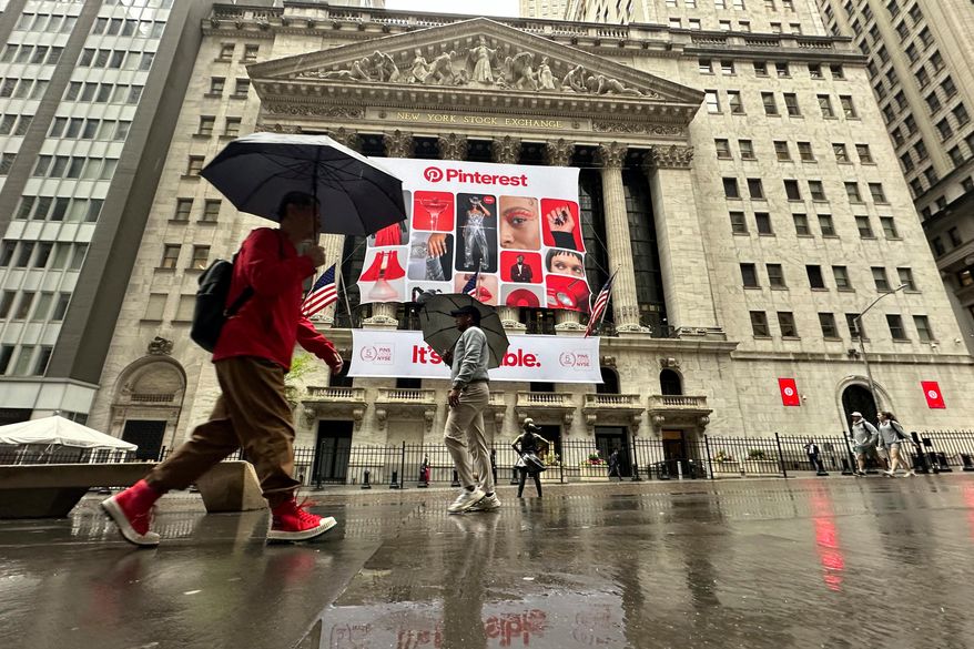 Banners for Pinterest, displayed to mark the fifth anniversary of the company's listing, hang on the front of the New York Stock Exchange in New York, May 15, 2024. (AP Photo/Peter Morgan, File)