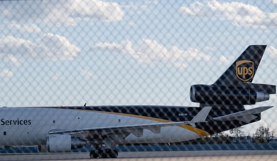 FILE - An MD-11F is seen parked at the UPS North Maintenance Hangar, Nov. 8, 2025, in Louisville, Ky. (AP Photo/Jon Cherry, File)