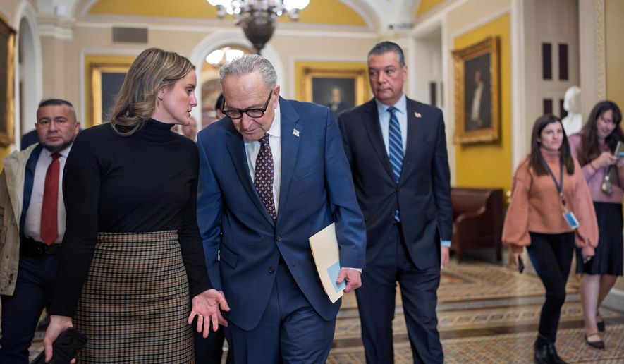 With a partial government shutdown looming by week's end, Senate Minority Leader Chuck Schumer, D-N.Y., joined at right by Sen. Alex Padilla, D-Calif., confers with an aide following a closed-door meeting with fellow Democrats on spending legislation that funds the Department of Homeland Security and other government agencies as the country, at the Capitol in Washington, Wednesday, Jan. 28, 2026. (AP Photo/J. Scott Applewhite) **FILE**