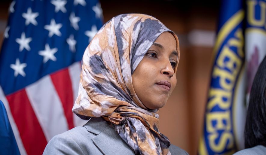 Rep. Ilhan Omar, D-Minn., the first Somali-American in Congress, stands with members of the Congressional Progressive Caucus as they announce they will work to limit funding for the Department of Homeland Security in the wake of the death of Renee Good, the woman shot and killed by a federal immigration agent in Minneapolis, during a news conference at the Capitol in Washington, Tuesday, Jan. 13, 2026. (AP Photo/J. Scott Applewhite) ** FILE **