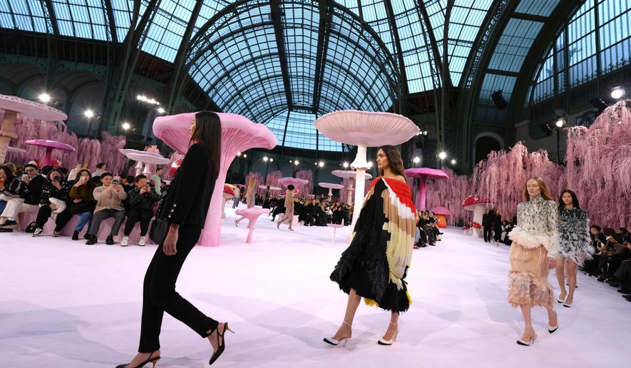 Models wear creations as part of the Chanel Spring/Summer 2026 Haute Couture collection presented in Paris, Tuesday, Jan. 27, 2026. (AP Photo/Aurelien Morissard)