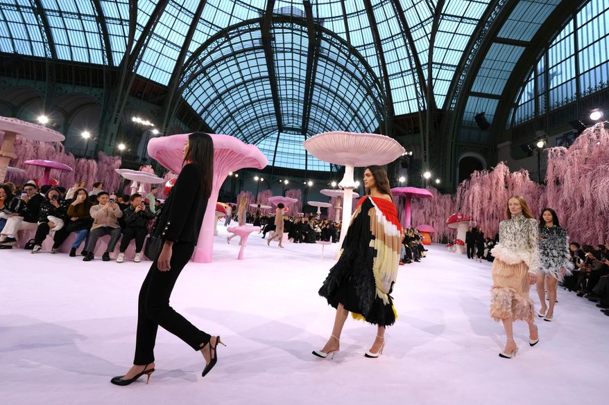 Models wear creations as part of the Chanel Spring/Summer 2026 Haute Couture collection presented in Paris, Tuesday, Jan. 27, 2026. (AP Photo/Aurelien Morissard)